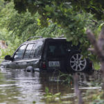 
              A vehicle is submerged after Hurricane Fiona in Salinas, Puerto Rico, Monday, Sept. 19, 2022. (AP Photo/Stephanie Rojas)
            