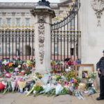 
              Flowers outside Buckingham Palace in London, following Thursday's death of Queen Elizabeth II, in London, Friday Sept. 9, 2022. (Dominic Lipinski/PA via AP)
            