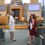 
              Chloe Akers, left, talks with Rabbi Laurie Rice and Dr. Nancy Lipsitz, right, before giving a presentation at Congregation Micah synagogue, Friday, Aug. 5, 2022 in Brentwood, Tenn. A gynecologist, Lipsitz describes the fear she’s seen in her patients. One decided to move out of state. Another asked her: If things go bad, will you have to let me die? (AP Photo/John Amis)
            
