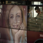 
              A poster of Italy's candidate premier Giorgia Meloni stands on the side of a bus in Rome, Friday, Sept. 16, 2022. Italy could be on the verge of electing its first woman premier. That prospect delights some Italian women, but others are dismayed by her conservative beliefs and policies. If opinion polls prove on the mark, Giorgia Meloni and the far-right Brothers of Italy party she co-founded less than a decade ago will triumph in Sept. 25 elections for Parliament. (AP Photo/Alessandra Tarantino)
            