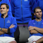 
              An emotional Roger Federer, left, of Team Europe sits alongside his playing partner Rafael Nadal after their Laver Cup doubles match against Team World's Jack Sock and Frances Tiafoe at the O2 arena in London, Friday, Sept. 23, 2022. Federer's losing doubles match with Nadal marked the end of an illustrious career that included 20 Grand Slam titles and a role as a statesman for tennis. (AP Photo/Kin Cheung)
            
