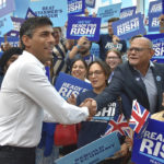 
              FILE - Rishi Sunak meets supporters as he arrives to attend a Conservative Party leadership election hustings at the NEC, Birmingham, England, Tuesday, Aug. 23, 2022. After weeks of waiting, Britain will finally learn who will be its new prime minister.  The governing Conservative Party will announce Monday, Sept. 5, 2022 whether Foreign Secretary Liz Truss or former Treasury chief Rishi Sunak won the most votes from party members to succeed Boris Johnson as party leader and British prime minister. (AP Photo/Rui Vieira, File)
            