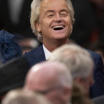 Populist Dutch anti-immigration lawmaker Geert Wilders laughs prior to a ceremony where Dutch King Willem-Alexander marked the opening of the parliamentary year with a speech outlining the government's budget plans for the year ahead at the Royal Theatre in The Hague, Netherlands, Tuesday, Sept. 20, 2022. (AP Photo/Peter Dejong)
