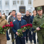 
              Denis Pushilin, the leader of the Donetsk People's Republic controlled by Russia-backed separatists, left, Russian Presidential Administration first deputy head, Sergei Kiriyenko, center, and Luhansk People's Republic controlled by Russia-backed separatists attend a laying ceremony during opening a monument to the Young Guards "Unconquered" in Krasnodon after restoration, in Krasnodon, Ukraine, Monday, Sept. 26, 2022. Voting began last Friday in four Moscow-held regions of Ukraine on referendums to become part of Russia. (AP Photo)
            