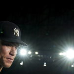 
              New York Yankees' Aaron Judge listens during an interview after the team's baseball game against the Toronto Blue Jays, in which he hit his 61st home run of the season, Wednesday, Sept. 28, 2022, in Toronto. (Nathan Denette/The Canadian Press via AP)
            