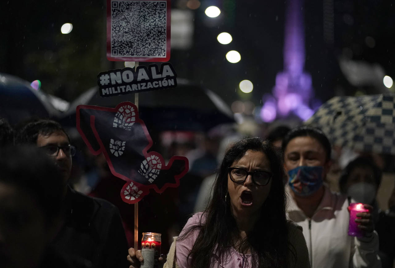 Demonstrators march on Reforma Avenue towards the senate to protest the president's proposal to mov...