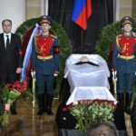 
              US ambassador to Russia John Joseph Sullivan, second left, walks to the coffin of former Soviet President Mikhail Gorbachev inside the Pillar Hall of the House of the Unions during a farewell ceremony in Moscow, Russia, Saturday, Sept. 3, 2022. Gorbachev, who died Tuesday at the age of 91, will be buried at Moscow's Novodevichy cemetery next to his wife, Raisa, following a farewell ceremony at the Pillar Hall of the House of the Unions, an iconic mansion near the Kremlin that has served as the venue for state funerals since Soviet times. (Alexander Nemenov/Pool Photo via AP)
            