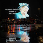 
              The image of Queen Elizabeth II is projected onto a large screen and reflected in a rainy street at Piccadilly Circus, in London, Thursday, Sept. 8, 2022. Queen Elizabeth II, Britain's longest-reigning monarch and a rock of stability across much of a turbulent century, died Thursday after 70 years on the throne. She was 96. (AP Photo/Alberto Pezzali)
            