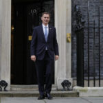 
              British Chancellor of the Exchequer Jeremy Hunt poses for media outside 10 Downing Street in London, Tuesday, Oct. 25, 2022. Former Treasury chief Rishi Sunak became Britain's first prime minister of color after being chosen Monday to lead a governing Conservative Party desperate for a safe pair of hands to guide the country through economic and political turbulence. (AP Photo/Kin Cheung)
            