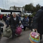 
              Evacuees from Kherson gather upon their arrival at the railway station in Dzhankoi, Crimea, Friday, Oct. 21, 2022. Russian authorities have encouraged residents of Kherson to evacuate, warning that the city may come under massive Ukrainian shelling. (AP Photo)
            