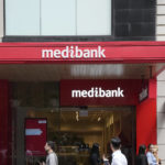 
              People walk past a Medibank branch in Sydney, Thursday, Oct. 20, 2022. Medibank health insurer is being extorted for customers' data in the nation's second major cybersecurity breach in a month, an official says. (AP Photo/Rick Rycroft)
            