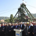 
              Turkey's President Recep Tayyip Erdogan, center, is surrounded by his ministers as he speaks to the media outside the coal mine in Amasra, in the Black Sea coastal province of Bartin, Turkey, Saturday, Oct. 15, 2022. Funerals for miners killed in a coal mine explosion in northern Turkey began Saturday as officials raised the death toll to at least 40 people. There were 110 miners working several hundred meters below ground when the explosion occurred Friday evening. (Turkish Presidency via AP )
            