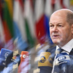 
              Germany's Chancellor Olaf Scholz speaks with the media as he arrives for an EU summit in Brussels, Thursday, Oct. 20, 2022. European Union leaders were heading into a two-day summit Thursday with opposing views on whether, and how, the bloc could impose a gas price cap to contain the energy crisis fueled by Russian President Vladimir Putin's invasion of Ukraine and his strategy to choke off gas supplies to the bloc at will. (AP Photo/Geert Vanden Wijngaert)
            