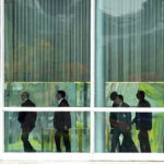 
              Brazilian President Jair Bolsonaro, third from left, leaves his official residence of Alvorada Palace to go to his office at Planalto palace in Brasilia, Brazil, Monday, Oct. 31, 2022, the morning after losing reelection to former Brazilian President Luiz Inacio Lula da Silva. (AP Photo/Eraldo Peres)
            