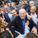 
              Former Brazilian President Luiz Inacio Lula da Silva, who is running for president again, greets supporters after he voted in the general election in Sao Paulo, Brazil, Sunday, Oct. 2, 2022. (AP Photo/Marcelo Chello)
            