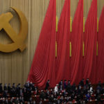 
              Delegates leave after the closing ceremony of the 20th National Congress of China's ruling Communist Party at the Great Hall of the People in Beijing, Saturday, Oct. 22, 2022. (AP Photo/Andy Wong)
            