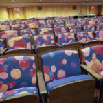 Floral themed pattern in the upholstered chairs appear in the newly renovated Wsu Tsai Theater at David Geffen Hall, Thursday, Aug. 25, 2022, at the Lincoln Center for the Performing Arts in New York. Geffen Hall opens Oct. 8 following a $550 million renovation with the orchestra's first concert there since March 10, 2020, the final performance before the pandemic shutdown. (AP Photo/Mary Altaffer)