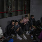 
              People sit in the Kyiv subway, using it as a bomb shelter, in Kyiv, Ukraine, on Wednesday, Oct. 19, 2022. (AP Photo/Emilio Morenatti)
            