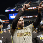 
              San Diego Padres starting pitcher Joe Musgrove, center, celebrates after the Padres defeated the New York Mets in Game 3 of a National League wild-card baseball playoff series, Sunday, Oct. 9, 2022, in New York. (AP Photo/John Minchillo)
            
