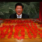 
              FILE - Chinese President Xi Jinping is displayed on a screen as performers dance at a gala show ahead of the 100th anniversary of the founding of the Chinese Communist Party in Beijing on June 28, 2021. Chinese President Xi Jinping was the son of a communist revolutionary leader, a victim of the Cultural Revolution and a provincial leader who promoted economic growth before ascending to the very top a decade ago. (AP Photo/Ng Han Guan, File)
            