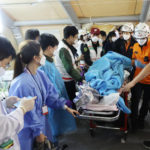 
              Rescue workers carry an injured person to the hospital in Seoul, South Korea, Sunday, Oct. 30, 2022. At least 120 people were killed and 100 more were injured as they were crushed by a large crowd pushing forward on a narrow street during Halloween festivities in the capital of Seoul, South Korean officials said. (See Dae-yeon/Yonhap via AP)
            