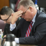 
              Defense attorney Andrew Kirkpatrick, right, awaits the verdict with his client, Paul Bellar, in a trial on Wednesday, Oct. 26, 2022 at the Jackson County Courthouse in Jackson, Mich. Bellar, Joseph Morrison and Pete Musico are accused of being involved in a plot to kidnap Michigan Gov. Gretchen Whitmer. The three were found guilty of one felony count each of gang membership, providing material support for terrorist acts and felony firearms. (J. Scott Park/Jackson Citizen Patriot via AP, Pool)
            