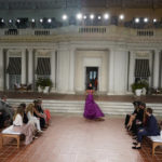 
              Audience members watch a model at the Ralph Lauren Spring 2023 Fashion Experience on Thursday, Oct. 13, 2022, at the Huntington Gardens in Pasadena, Calif. (AP Photo/Chris Pizzello)
            