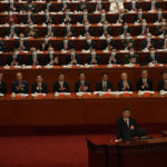 
              Delegates applaud as Chinese President Xi Jinping speaks during the opening ceremony of the 20th National Congress of China's ruling Communist Party held at the Great Hall of the People in Beijing, China, Sunday, Oct. 16, 2022. China on Sunday opens a twice-a-decade party conference at which leader Xi Jinping is expected to receive a third five-year term that breaks with recent precedent and establishes himself as arguably the most powerful Chinese politician since Mao Zedong. (AP Photo/Mark Schiefelbein)
            