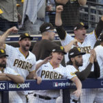 
              San Diego Padres celebrate after Philadelphia Phillies' Bryce Harper was called out at first during the first inning in Game 1 of the baseball NL Championship Series between the San Diego Padres and the Philadelphia Phillies on Tuesday, Oct. 18, 2022, in San Diego. (AP Photo/Ashley Landis)
            