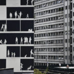 
              A full-scale monochrome mural by the Brazilian architect studio Nitsche Arquitetos adorns a “blind wall”, near Minhocao Park in Sao Paulo, Brazil, Saturday, Oct. 29, 2022. On Sunday, Brazilians head to the voting booth to choose between the top two presidential candidates who are facing each other in a runoff vote after neither got enough support to win outright in the Oct. 2 general election. (AP Photo/Matias Delacroix)
            