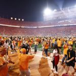 
              Fans storm the field after an NCAA college football game between Tennessee and Alabama, Saturday, Oct. 15, 2022, in Knoxville, Tenn. Tennessee won 52-49. (AP Photo/Wade Payne)
            