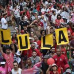 
              Supporters of former President Luiz Inacio Lula da Silva attend a campaign rally in Sao Paulo, Brazil, Saturday, Oct. 29, 2022. On Sunday, Brazilians head to the voting booth again to choose between da Silva and incumbent Jair Bolsonaro, who are facing each other in a runoff vote after neither got enough support to win outright in the Oct. 2 general election. (AP Photo/Matias Delacroix)
            