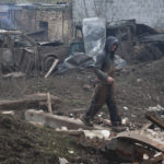 
              A local resident walks in yard of small business that was damaged after an overnight Russian attack in Kramatorsk, Ukraine, Thursday, Oct. 27, 2022. (AP Photo/Andriy Andriyenko)
            