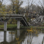 
              A view of a collapsed bridge across the Siverskyi-Donets river, in the liberated town of Sviatohirsk, Donetsk region, Ukraine, Saturday, Oct. 29, 2022. (AP Photo/Andriy Andriyenko)
            