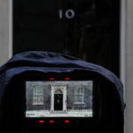 
              Number 10 Downing Street is seen through the lens of a television camera waiting outside the office in London, Monday, Oct. 24, 2022. Former British Treasury chief Rishi Sunak is frontrunner in the Conservative Party's race to replace Liz Truss as prime minister. (AP Photo/Alastair Grant)
            