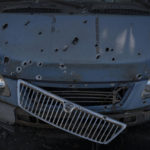 
              A car damaged from shrapnel is seen at a parking lot after a Russian attack in Zaporizhzhia, Ukraine, Saturday, Oct. 15, 2022. (AP Photo/Leo Correa)
            