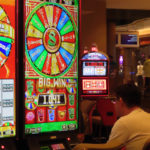 A gambler rings up a win on a slot machine at the Hard Rock casino in Atlantic City, N.J., Aug. 8, 2022. On Oct. 17, 2022, New Jersey gambling regulators reported Atlantic City's casinos won nearly $252 million from in-person gamblers in September, putting them on track to exceed pre-pandemic levels of revenue by the end of the year. (AP Photo/Wayne Parry)