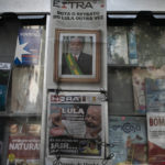 
              Brazilian newspapers for sale carry headlines about the election victory of former President Luiz Inacio Lula da Silva over current President Jair Bolsonaro in Rio de Janeiro, Brazil, Monday, Oct. 31, 2022. (AP Photo/Bruna Prado)
            