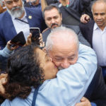 
              A supporter kisses former Brazilian President Luiz Inacio Lula da Silva, who is running for president again, after he voted in general elections in Sao Paulo, Brazil, Sunday, Oct. 2, 2022. (AP Photo/Marcelo Chello)
            