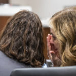 
              Lesli Boese, Assistant Waukesha district attorney, right, whispers to Waukesha County district attorney Susan Opper during the Darrell Brooks trial in a Waukesha County Circuit Court in Waukesha, Wis., on Thursday, Oct. 20, 2022. Brooks, who is representing himself during the trial, is charged with driving into a Waukesha Christmas Parade last year, killing six people and injuring dozens more. (Scott Ash/Milwaukee Journal-Sentinel via AP, Pool)
            