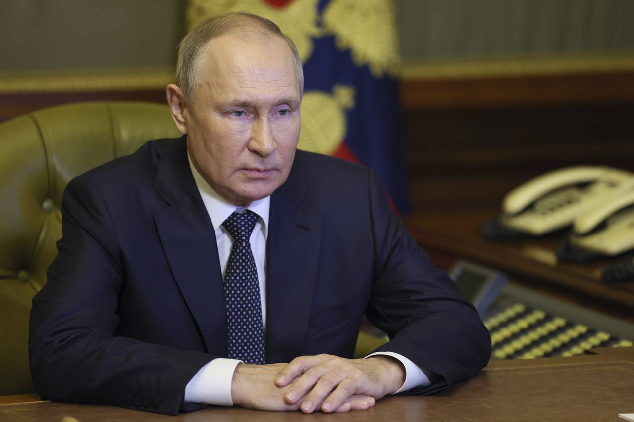 FILE - Russian President Vladimir Putin chairs a Security Council meeting via videoconference in St...