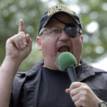 
              FILE - Stewart Rhodes, founder of the Oath Keepers, speaks during a rally outside the White House in Washington, June 25, 2017. A member of the Oath Keepers who traveled to Washington before the Jan. 6 attack at the U.S. Capitol testified during the seditious conspiracy case against Oath Keepers founder Stewart Rhodes and four associates on Wednesday, Oct. 12, 2022, about a massive cache of weapons the far-right extremist group stashed in a Virginia hotel room. (AP Photo/Susan Walsh, File)
            