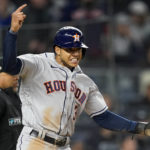 
              Houston Astros Jeremy Pena (3) reacts after scoring on a base hit by Alex Bregman against the New York Yankees during the seventh inning of Game 4 of an American League Championship baseball series, Sunday, Oct. 23, 2022, in New York. (AP Photo/John Minchillo)
            