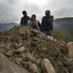 
              Habibe Ayvaz, 63, and Recep Ayzaz, 62, parents of the miner killed in a coal mine explosion, Selcuk Ayvas, 33, weep over his grave in Amasra, in the Black Sea coastal province of Bartin, Turkey, Sunday, Oct. 16, 2022. (AP Photo/Khalil Hamra)
            