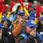 
              Trade union members blow horns during a protest outside the government headquarters in Bucharest, Romania, Thursday, Oct. 20, 2022. People joined a protest dubbed "The Anti-Poverty March" demanding salary and pensions increases and government controlled prices for energy and other basic commodities. (AP Photo/Andreea Alexandru)
            