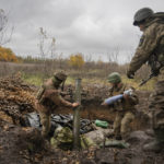 
              Ukrainian soldiers prepare a mortar to fire in the front line near Bakhmut, the site of the heaviest battle against the Russian troops in the Donetsk region, Ukraine, Thursday, Oct. 27, 2022. (AP Photo/Efrem Lukatsky)
            