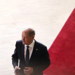 
              Germany's Chancellor Olaf Scholz arrives for an EU summit at the EU Council building in Brussels, Thursday, Oct. 20, 2022. European Union leaders were heading into a two-day summit Thursday with opposing views on whether, and how, the bloc could impose a gas price cap to contain the energy crisis fueled by Russian President Vladimir Putin's invasion of Ukraine and his strategy to choke off gas supplies to the bloc at will. (AP Photo/Olivier Matthys)
            