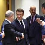 
              From left, Romania's President Klaus Werner Ioannis, Germany's Chancellor Olaf Scholz, France's President Emmanuel Macron, European Council President Charles Michel, Spain's Prime Minister Pedro Sanchez and European Commission President Ursula von der Leyen during a round table meeting at an EU summit in Brussels, Friday, Oct. 21, 2022. European Union leaders are gathering Friday to take stock of their support for Ukraine after President Volodymyr Zelenskyy warned that Russia is trying to spark a refugee exodus by destroying his war-ravaged country's energy infrastructure. (AP Photo/Geert Vanden Wijngaert)
            