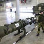 
              FILE - A Russian military officer walks past the 9M729 land-based cruise missile on display with its launcher, right, in Kubinka outside Moscow, Russia, Wednesday, Jan. 23, 2019. As Russia bombarded Ukraine this week, military observers were left wondering about how many and what types of missiles Russia still has in its arsenal. In other words, how long can the Kremlin keep up the barrage? (AP Photo, File)
            