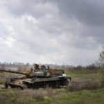 
              A Russian tank damaged in recent fighting is seen in the field near the recently retaken village of Kamianka, Kharkiv region, Ukraine, Sunday, Oct. 30, 2022. (AP Photo/Efrem Lukatsk)
            